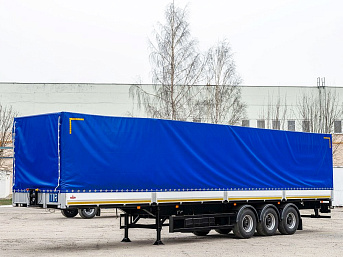 Полуприцеп бортовой тентованный МАЗ 975800-0003010 новый