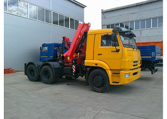 Седельный тягач КАМАЗ 65116 с КМУ FASSI F155 A.0.22 (ЕВРО 5) новый